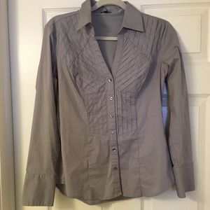 V-neck button down with great detail!